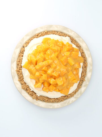 Top view of a mango passionfruit cream pie.