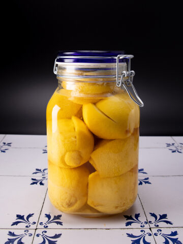 jar of preserved lemons on tile counter