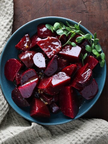 Bowlful of roasted beets cut into chunks.