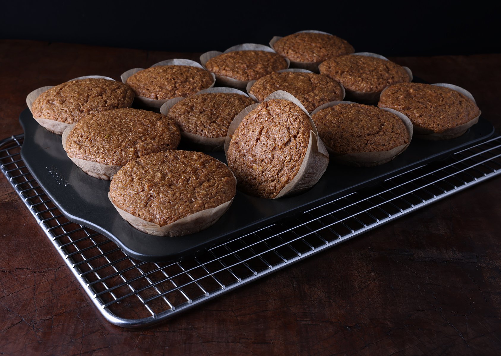 Whole wheat apple bran muffins cooling in the muffin pan.