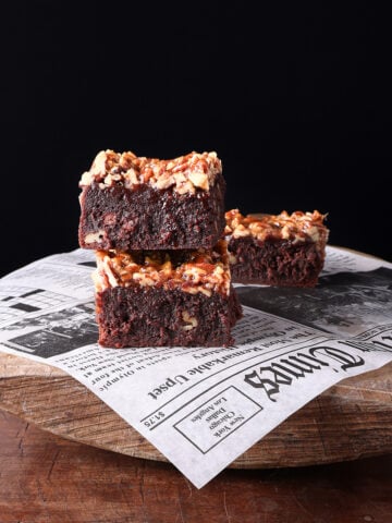 Thick pean pie brownies quares stacked up on one another.