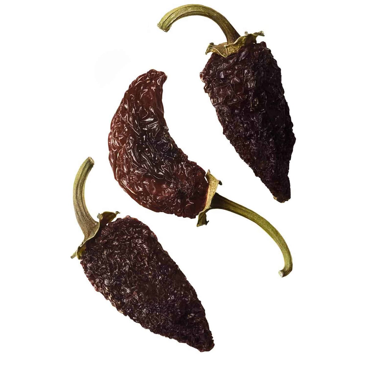 three morita chiles on white background, it is the smoked red jalapeno