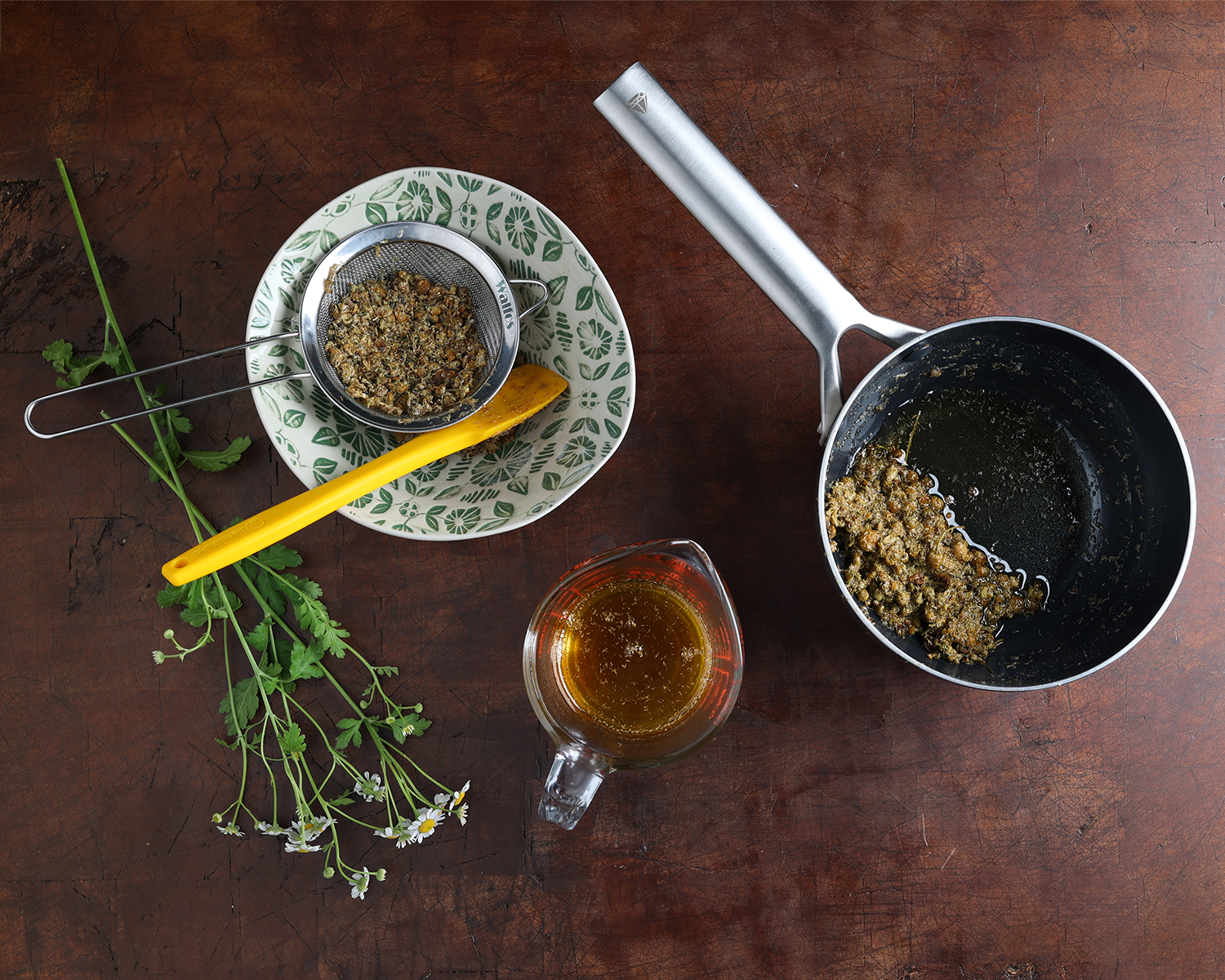 Process shot of preparing chamomile syrup.