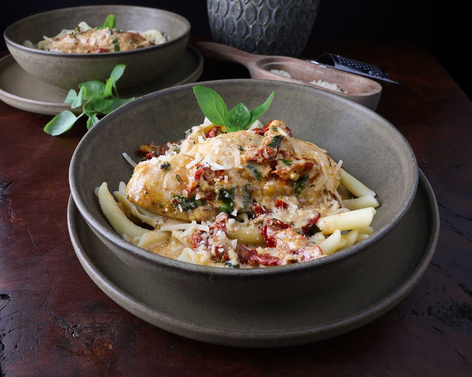 Marry me chicken served over pasta with creamy parmesan sundried tomato sauce.