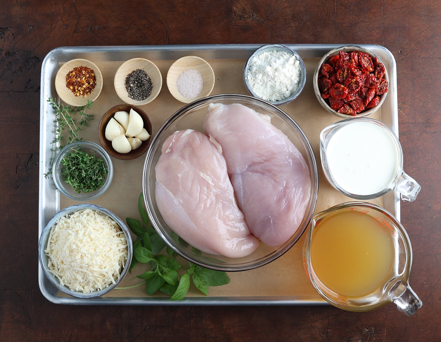 Ingredients shown are used to prepare the parmesan sundried tomato chicken.