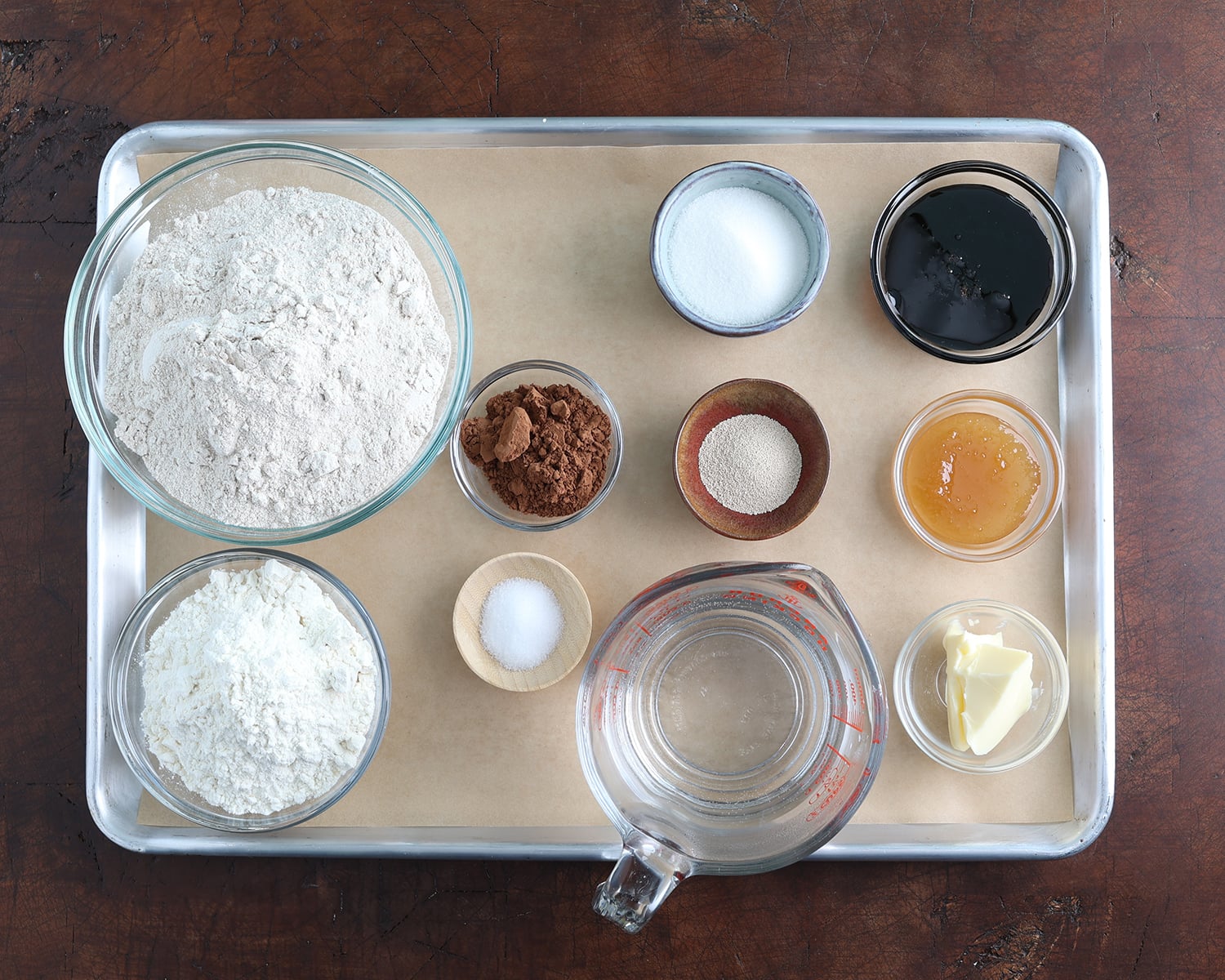 Ingredients for Honey Molasses Brown Bread on a bakesheet