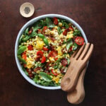 Large salad bowl with BLT Corn salad served in it.