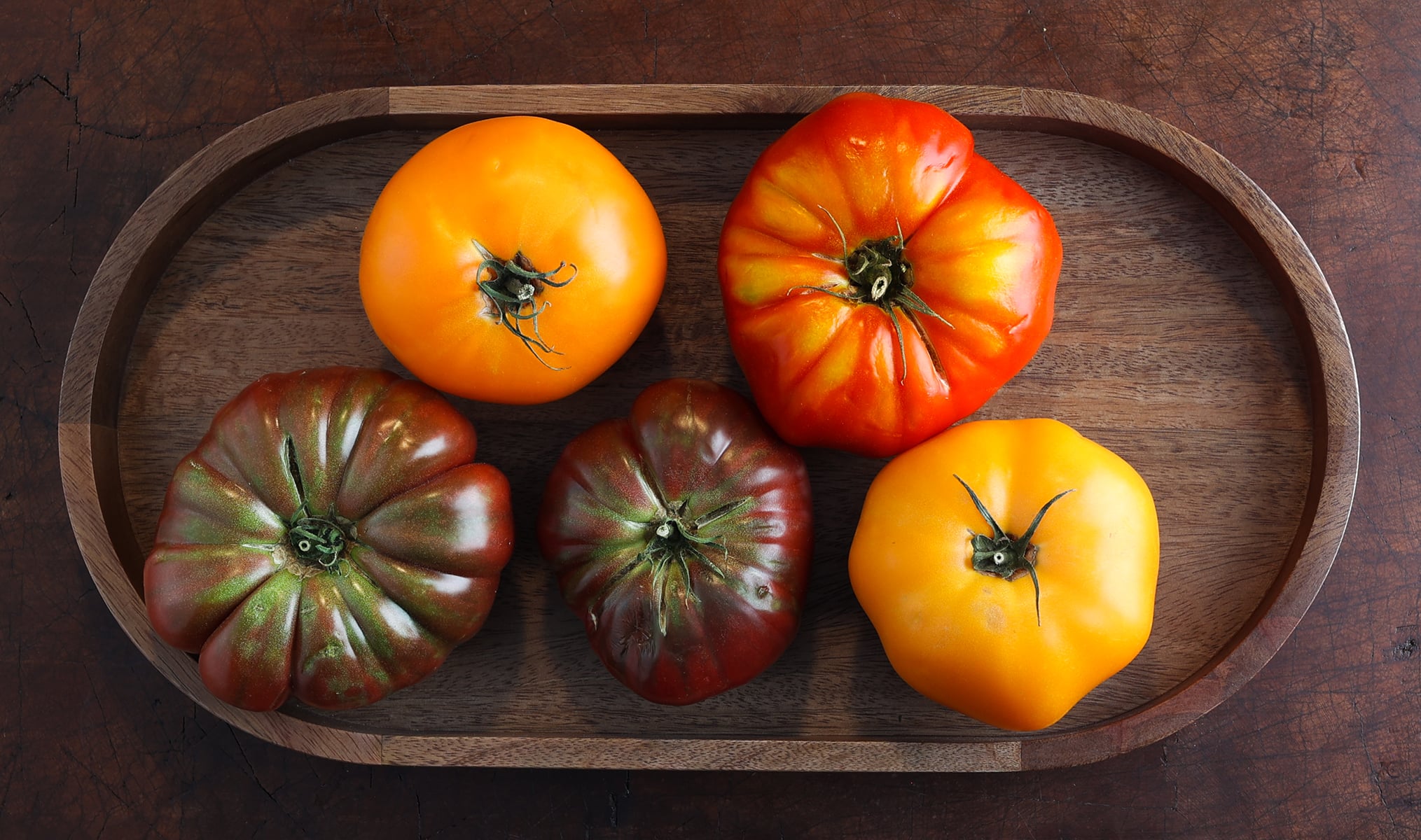 Fresh bright various colored heirloom tomatoes.